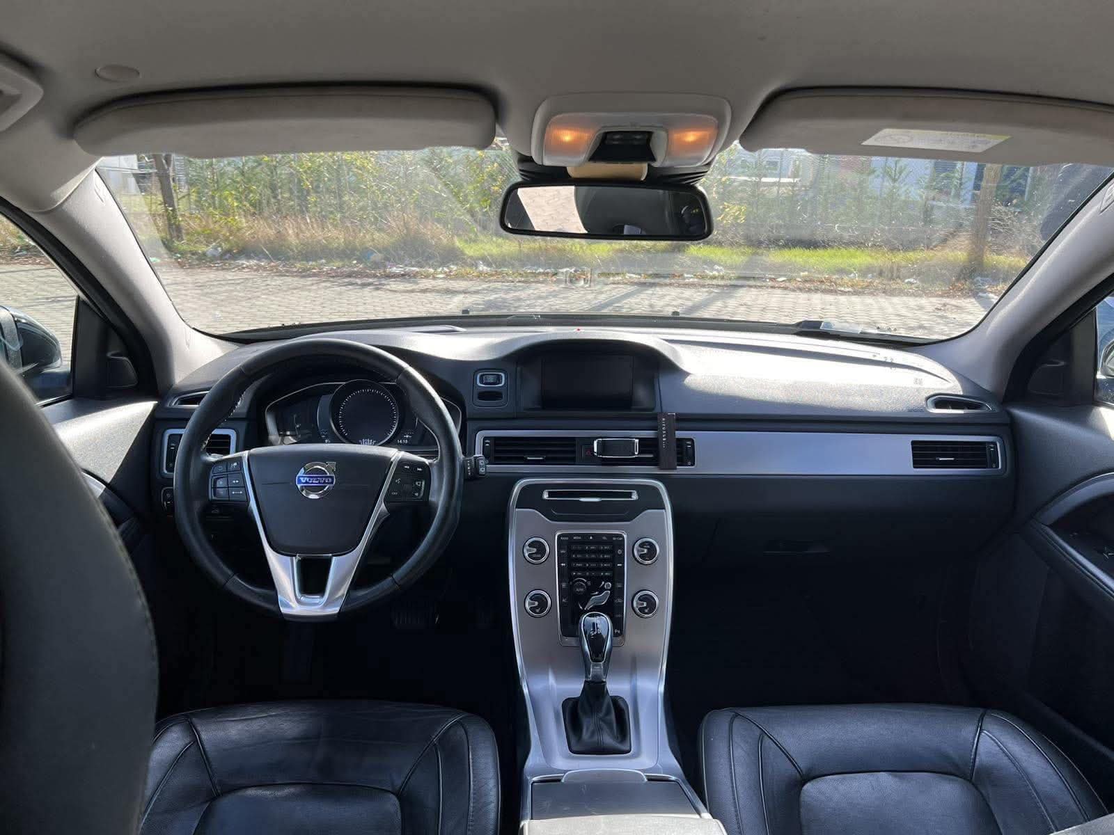 Volvo V70 interior with dashboard and front seats, automatic car hire Tirana