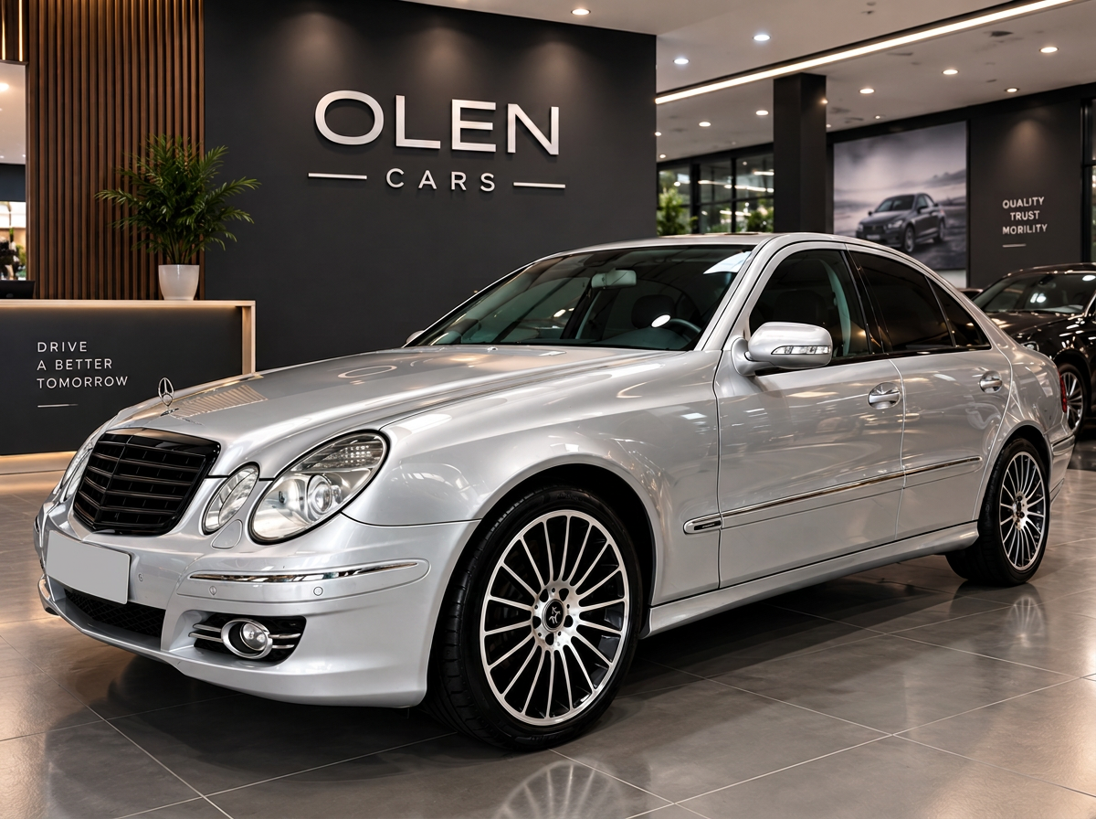 Silver Mercedes-Benz E-Class W211 front three-quarter view in the showroom, car rental Tirana