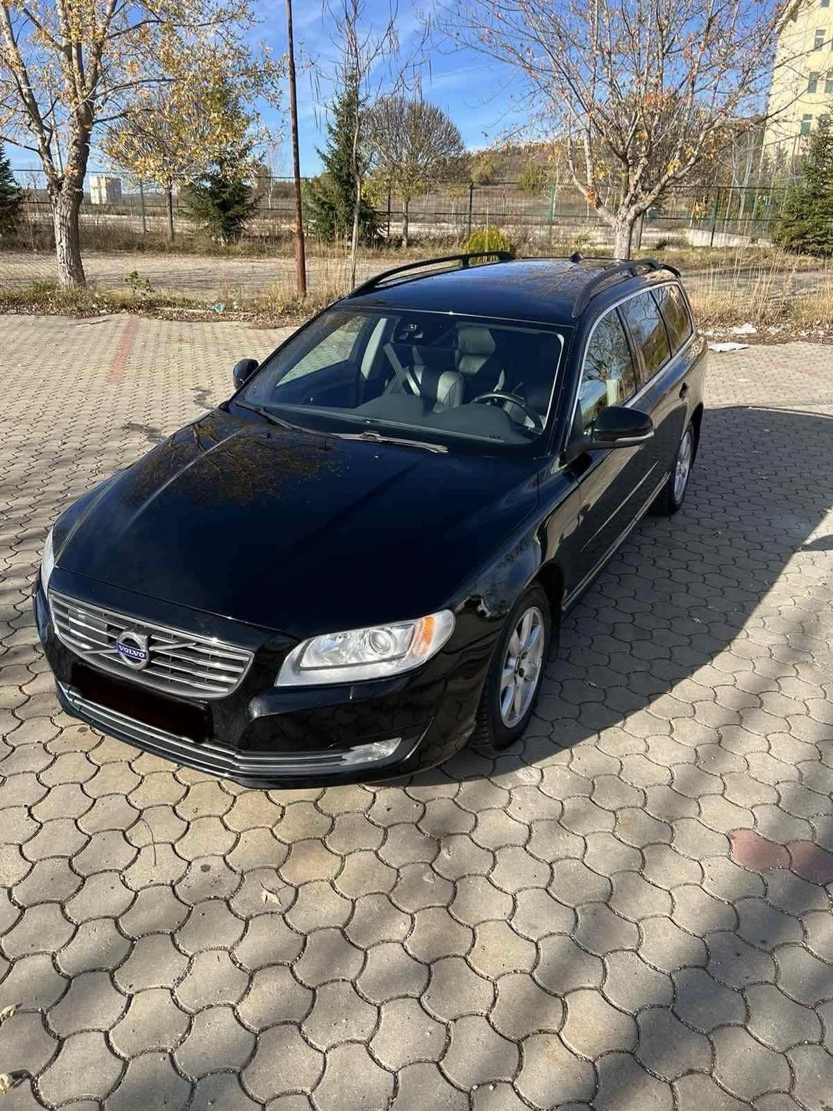 Volvo V70 2016 automatic rental car front three-quarter view in Tirana, Albania